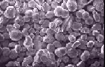 high-density tungsten based metals converted into spheroidal forms of W seen through an SEM magnified 200 times